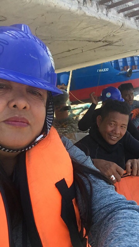 Two crew members in life vests preparing for dive operations