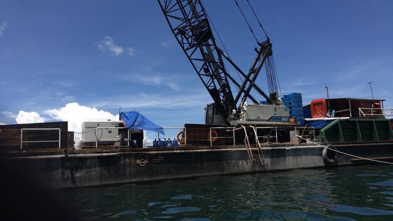 Barge with crane and heavy marine equipment